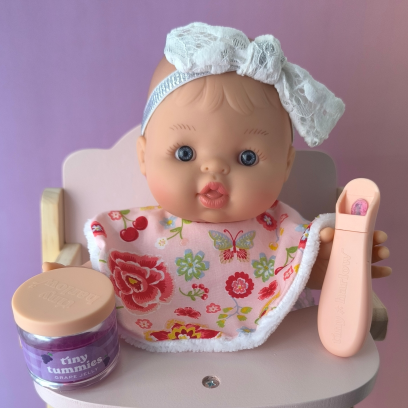 Bavoir pour poupée 32-36 cm – fleurs rose
